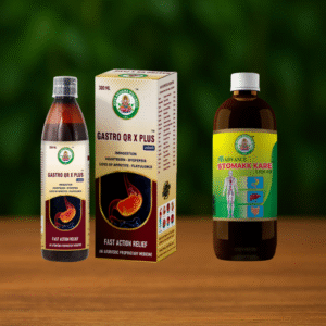 Two bottles of liquid medicine and a box labeled Stomakk Kare & Gastro QR X Plus Combo, featuring digestive relief benefits, are displayed on a wooden surface with a blurred green background.