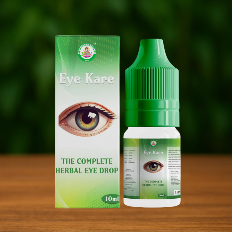 A 10ml bottle of Ayur Brahma Eye Kare herbal eye drops stands beside its box, which features an illustrated eye and the phrase "The Complete Herbal Eye Drop" on a green and white background.