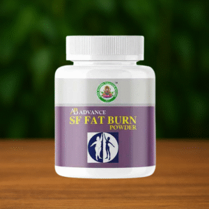 A white plastic bottle labeled Ayur Brahma SF Fat Burn Powder, featuring a purple and white design, sits on a wooden surface with a blurred green background.